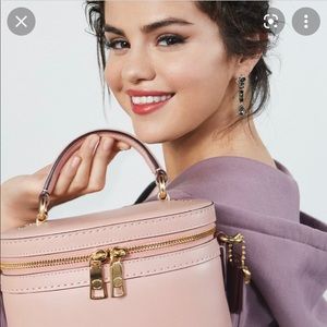 It’s an authentic coach pink, leather medium bucket bag.